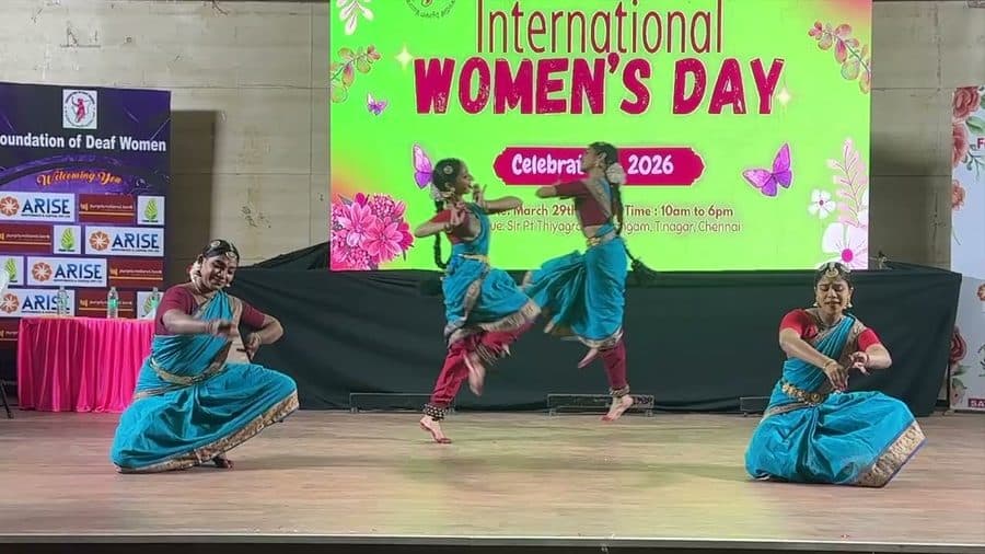 Shanti Kala Nikketan teachers dancing on stage at the Foundation of Deaf Women’s International Women’s Day event