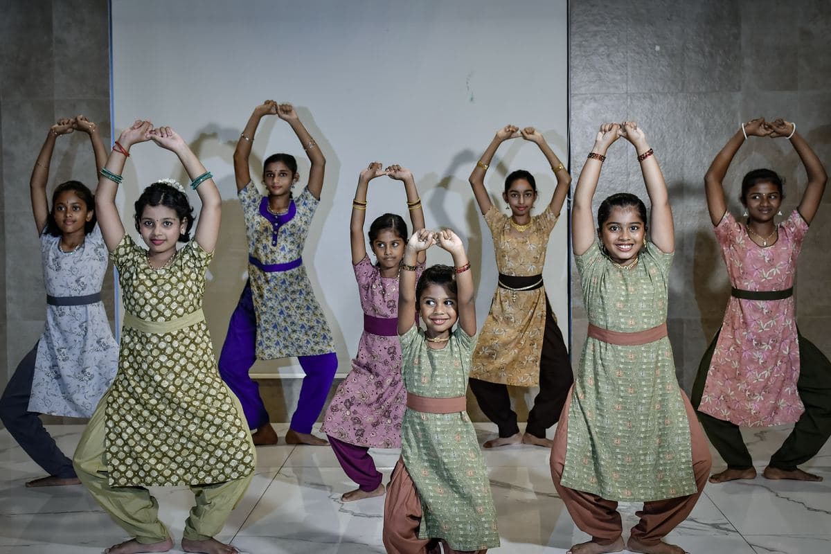 A Level 1 batch at Casagrand Tranquil, students in a line with their arms raised overhead
