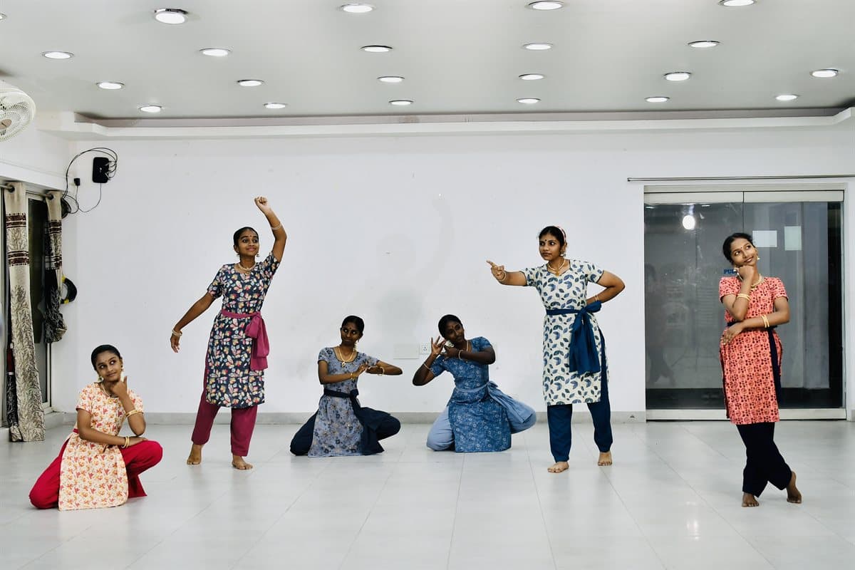 Students at Casagrand Riviera, some standing and some kneeling in pose
